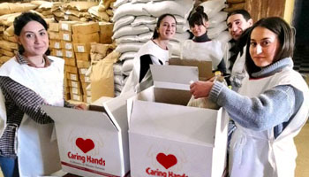 girls packing caring hand food boxes